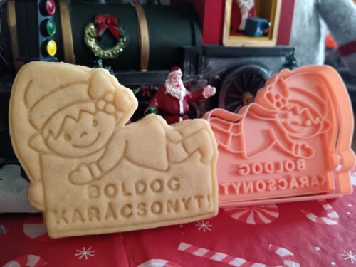 Boldog karácsonyt feliratos kiszúró és mintázó manóval